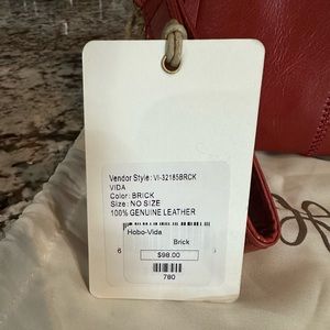 Hobo clutch. Brick color. New with tags. Never used.